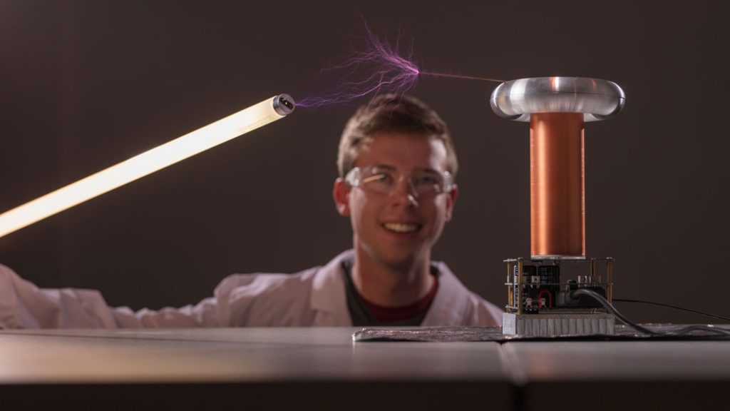 student with tesla coil project