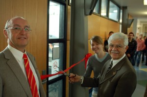 Dr. Jiles, Brittany Oswald, and Interim Dean Mufit Ainck cut the ribbon